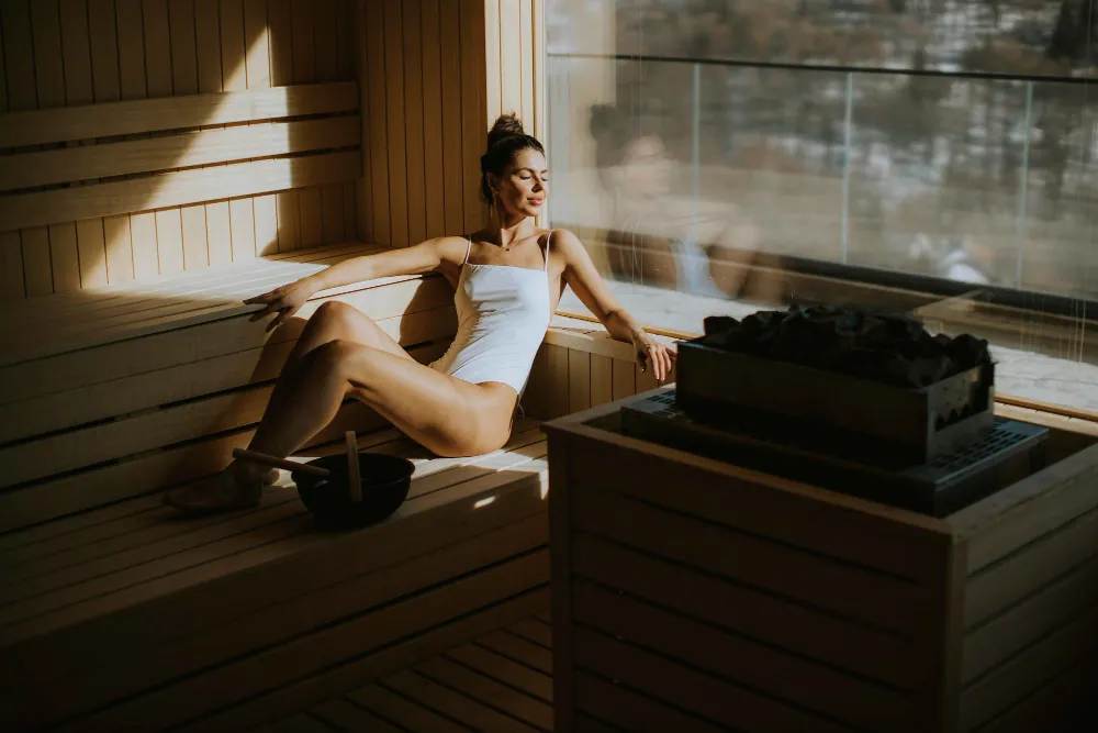 A guest relaxing in the warm glow of Haven Wellness