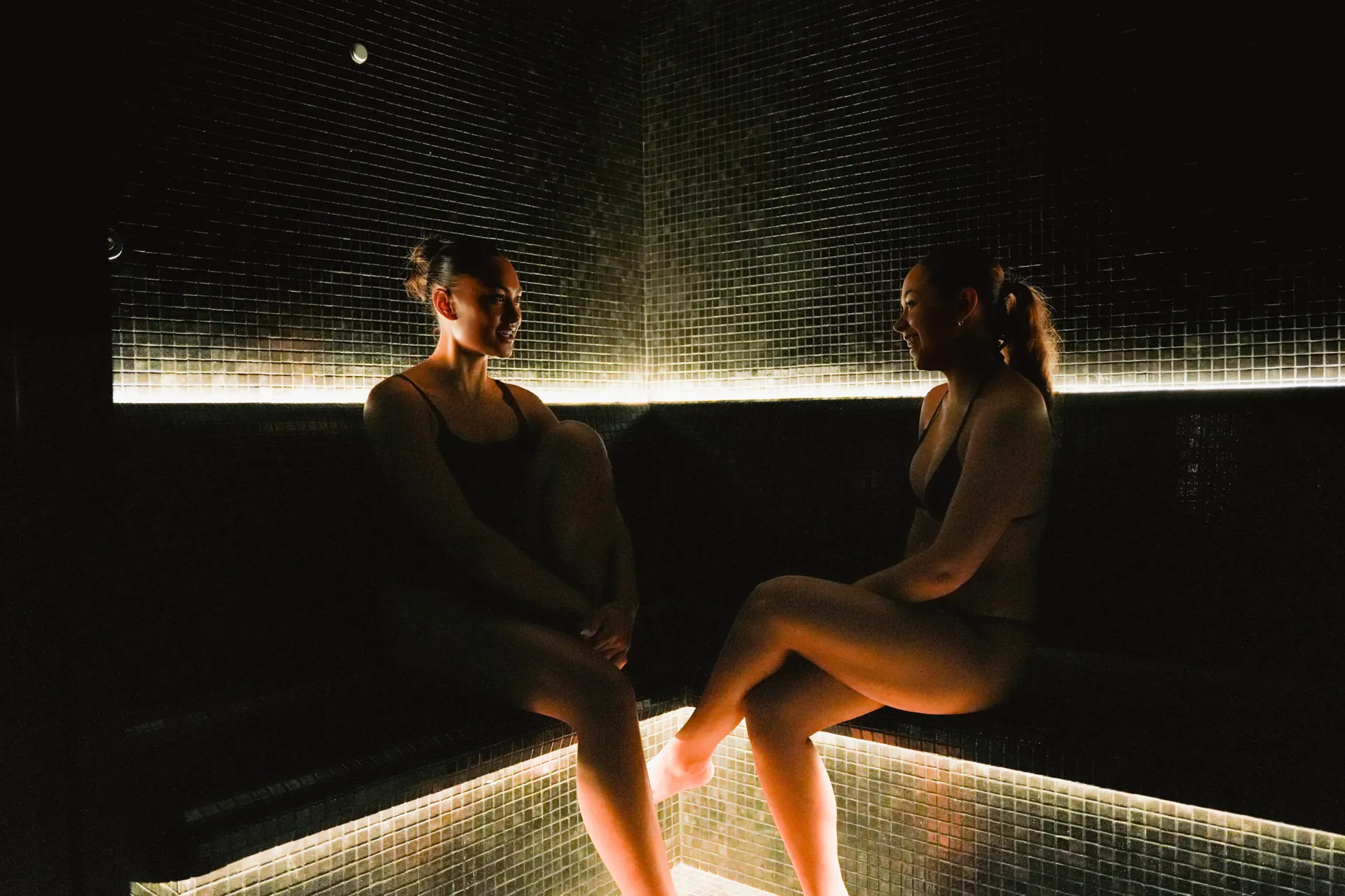 Two guests sharing the steam room at Haven Wellness